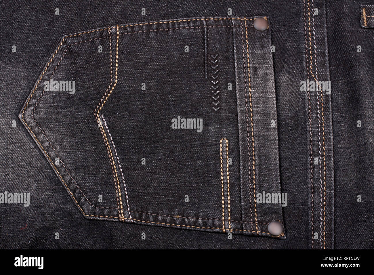 back pocket of dark jeans close up Stock Photo - Alamy