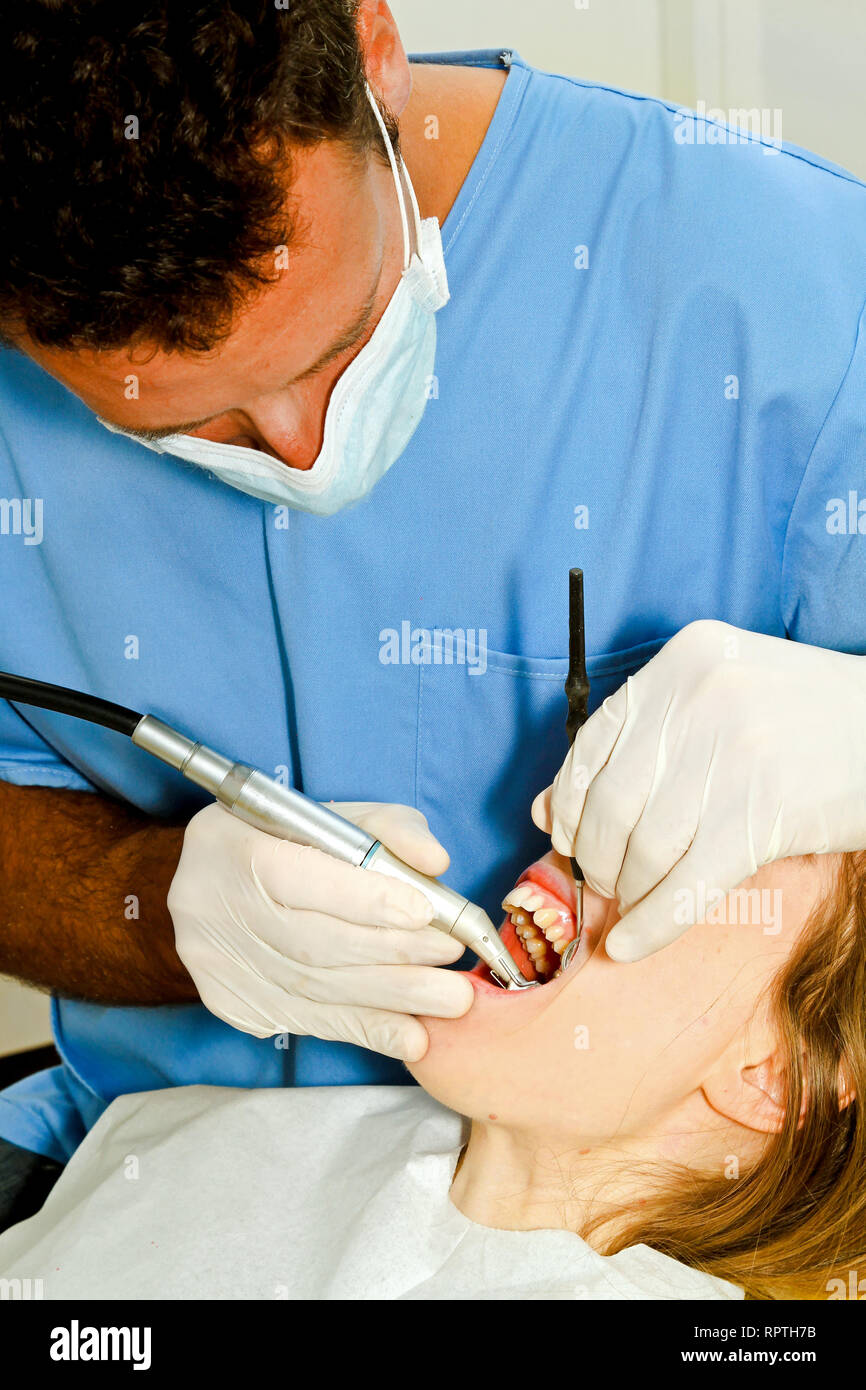 Girl at dental office during drilling procedure Stock Photo Alamy