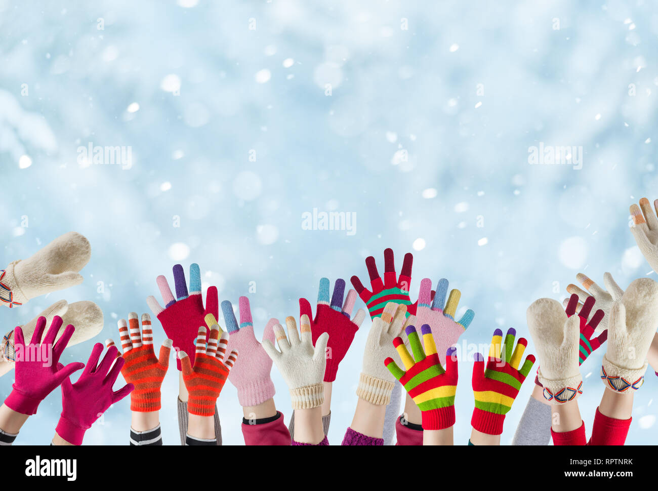 children hands with winter gloves and mittens background Stock Photo