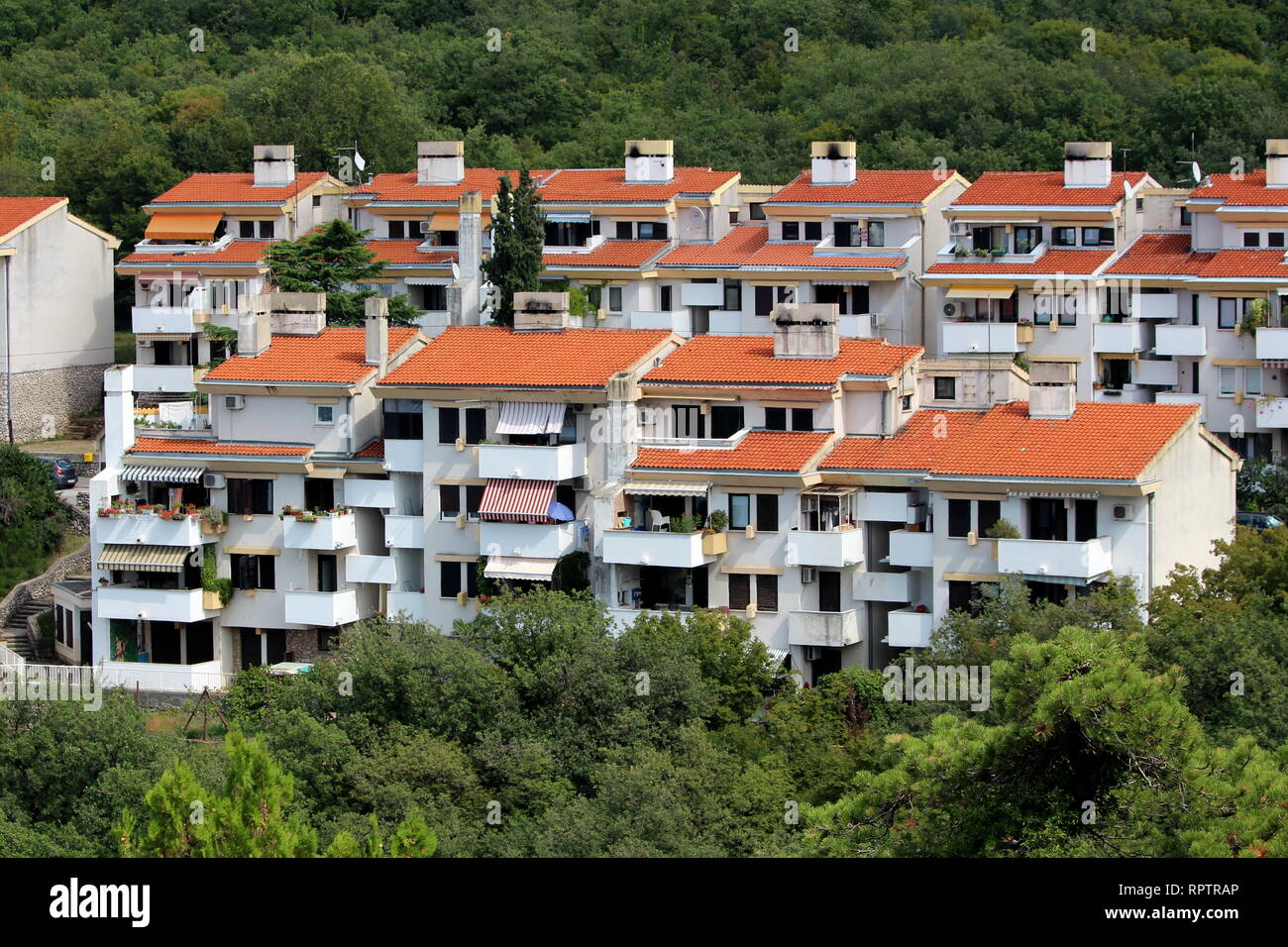 Closely built attached apartment building with few floors and multiple