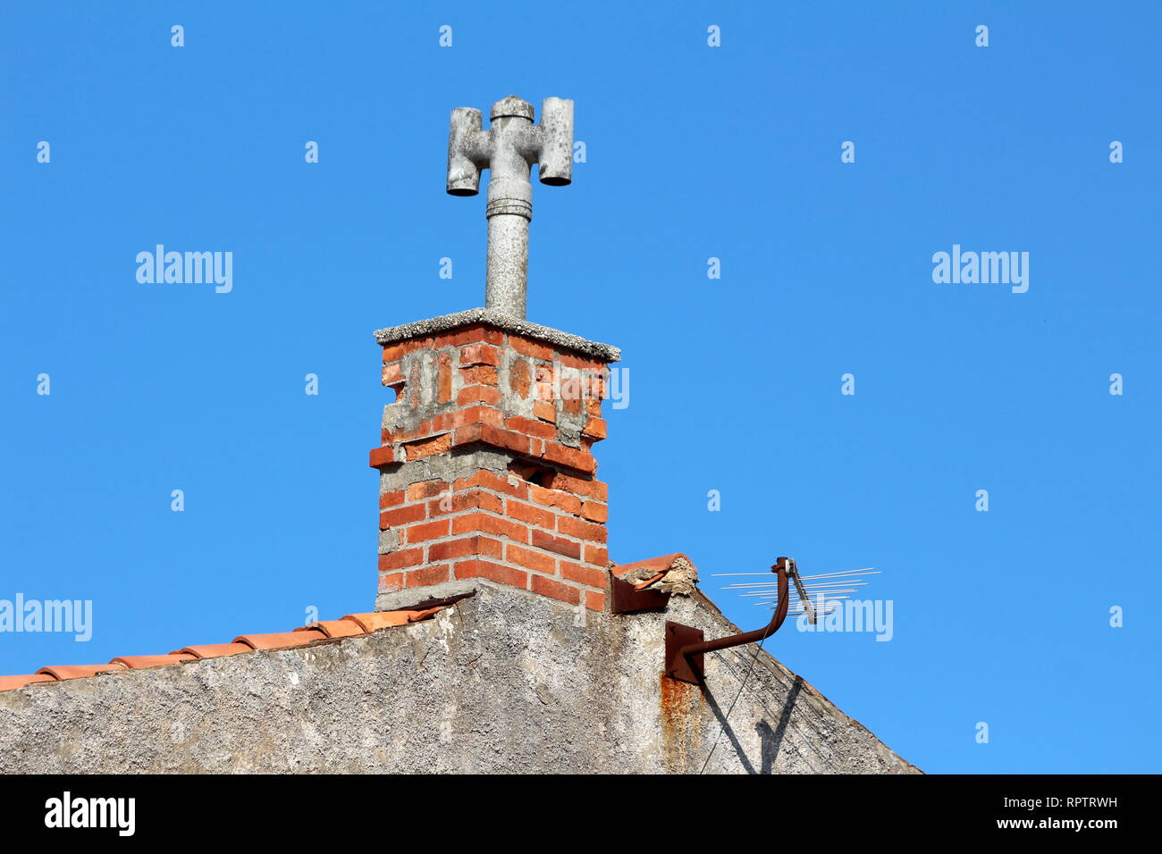 Family house chimney with concrete top in form of closed concrete pipe