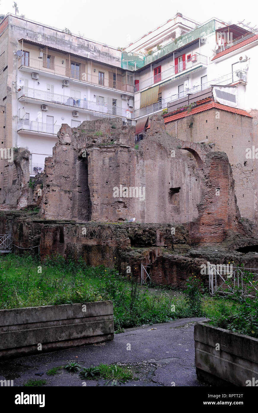 Near the Duomo of Naples there is the archaeological complex of Vico Carminiello ai Mannesi. It brought to light by the bombings of 1943, which destroyed the Church of Santa Maria del Carmine at Mannesi and adjacent buildings, documents part of an insula (isolated) of the ancient city also occupied by a small thermal building. This is a multi-layered construction, quite articulated, dating from its main structures at the end of the first century AD, but which presents elements attributable to different phases, the oldest of which belong to the Republican age. Stock Photo
