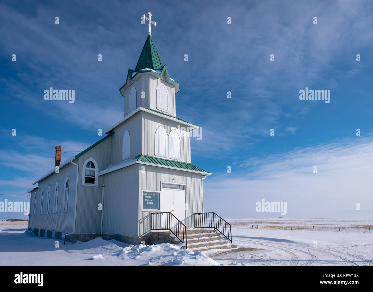 Snow surrounds the historic Peace Lutheran Church on the prairies in Saskatchewan Stock Photo