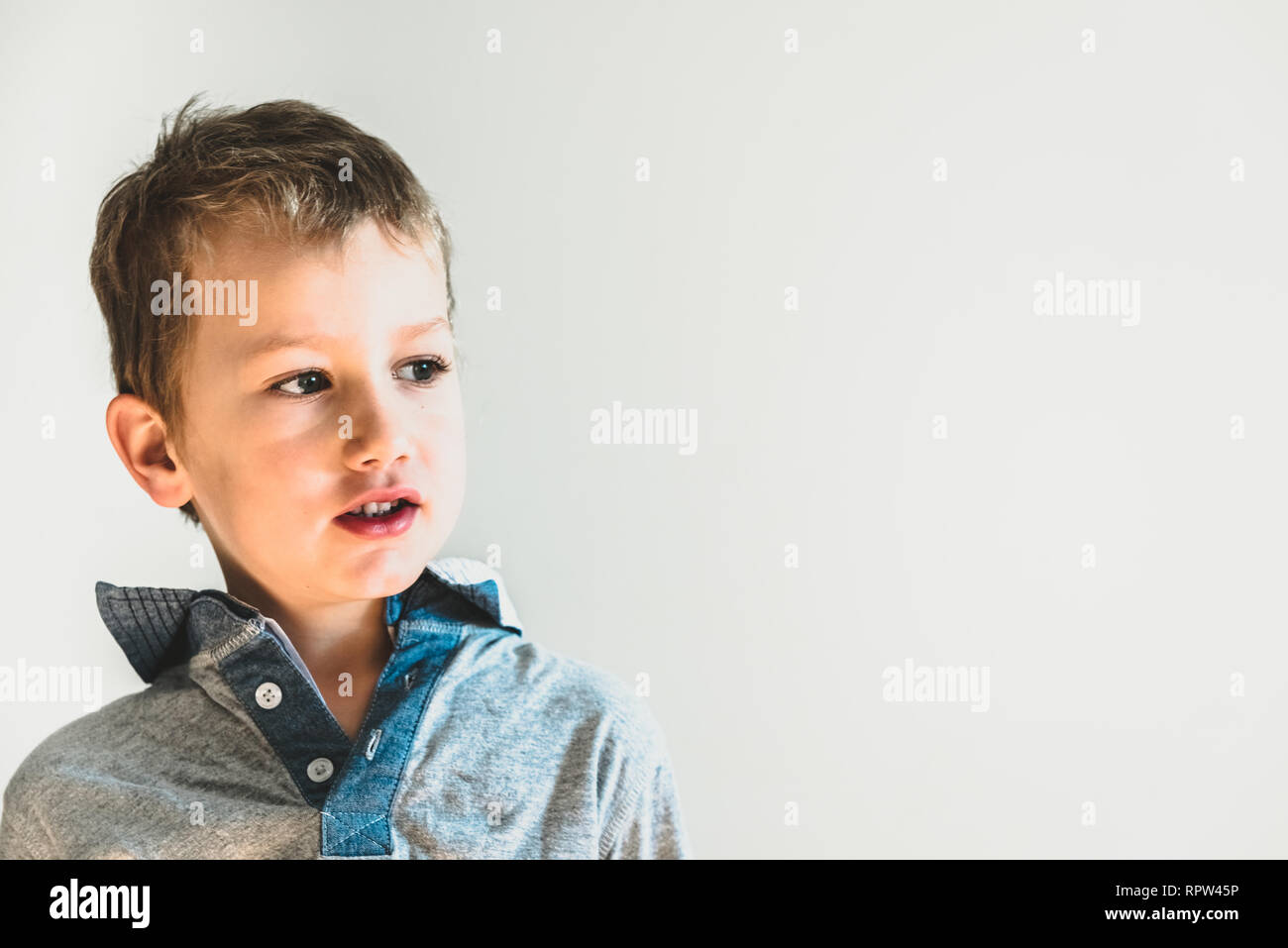 Portrait of a handsome boy looking at camera Stock Photo - Alamy