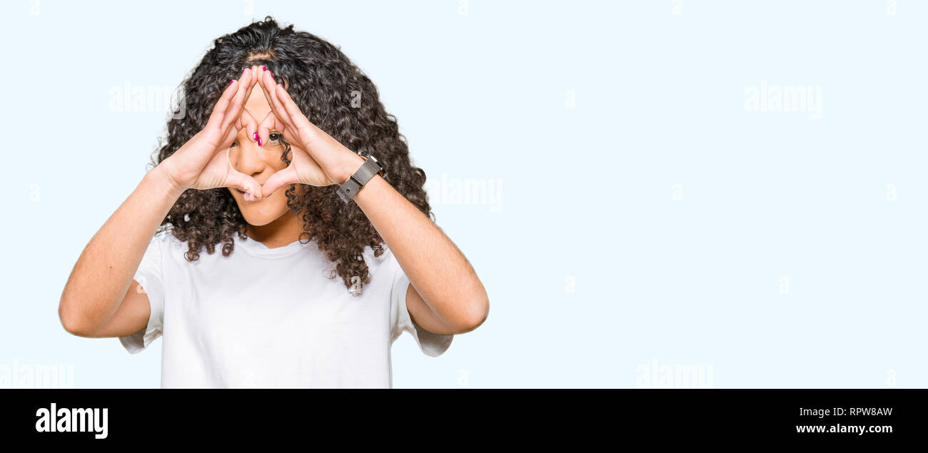 Young Beautiful Woman With Curly Hair Wearing White T Shirt Doing