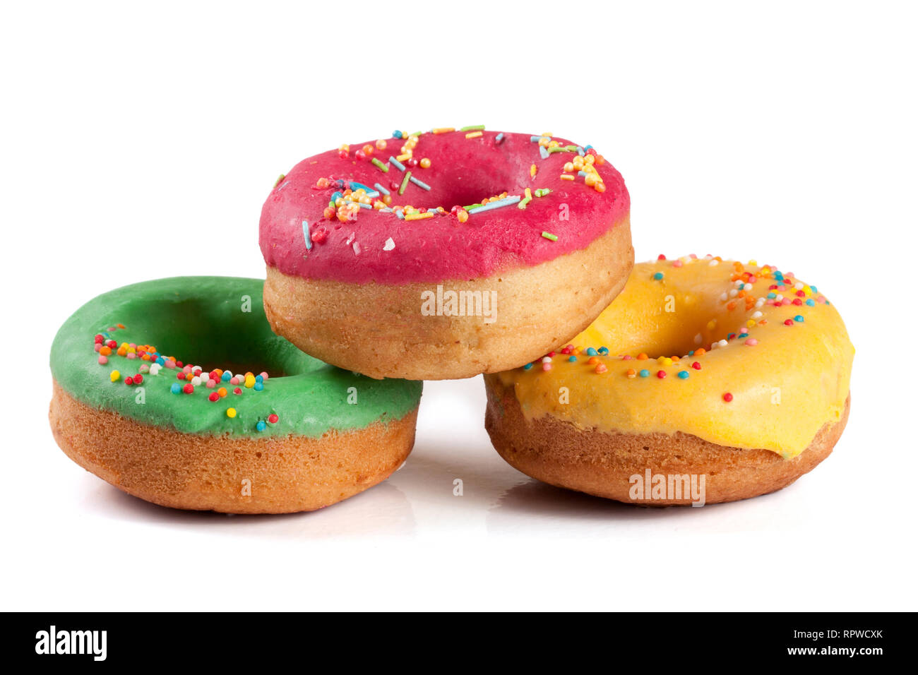 three glazed donut isolated on white background Stock Photo - Alamy