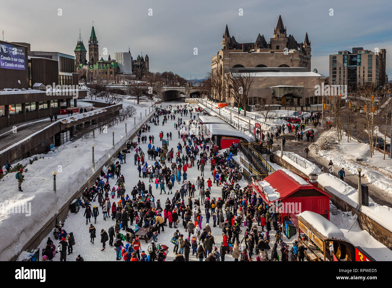 People celebrate the Winterlude festival on the frozen Rideau Canal