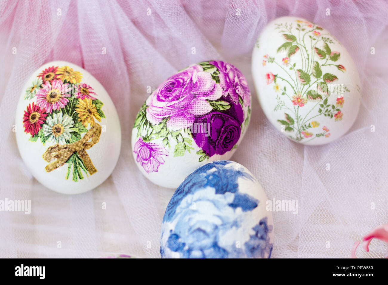 Beautiful Easter eggs decorated with paper napkins and flowers on white  tulle background; decoupage technique Stock Photo - Alamy