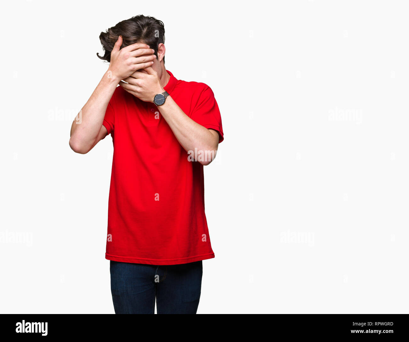 Young handsome man wearing red tshirt over isolated background Covering eyes and mouth with