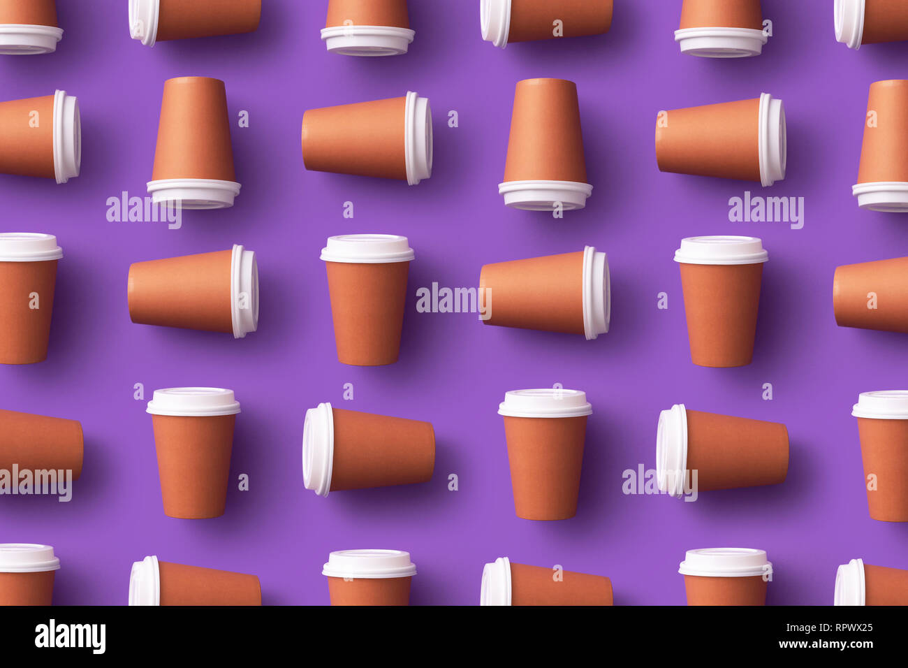 Multiple disposable coffee cups organized over purple background Stock Photo Alamy