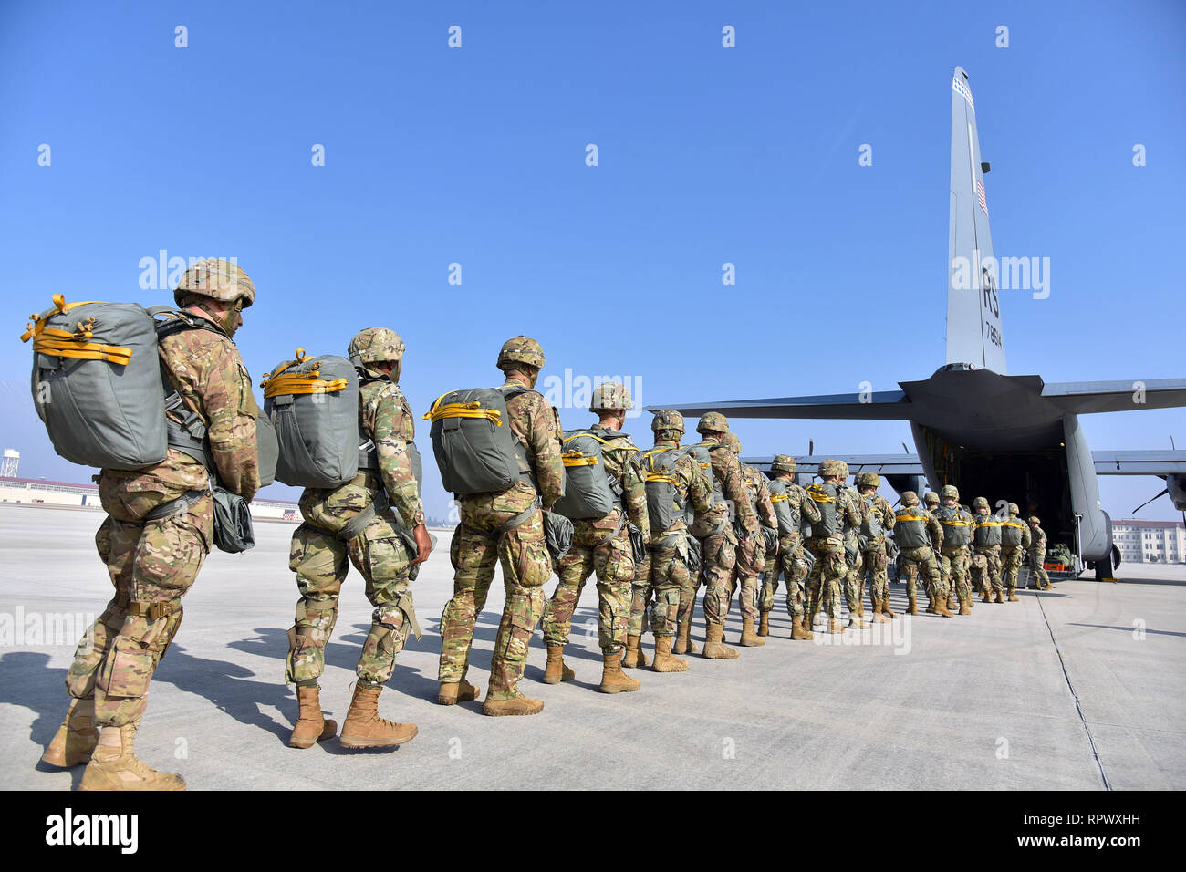 U.S. Army Paratroopers assigned to the 173rd Airborne Brigade, prepare to board a U.S. Air Force C-130 Hercules aircraft from the 86th Air Wing at Aviano Air Base, in preparation for airborne operations onto Juliet Drop Zone, Pordenone, Italy Feb. 21, 2019. The 173rd Airborne Brigade is the U.S. Army Contingency Response Force in Europe, capable of projecting ready forces anywhere in the U.S. European, Africa or Central Commands' areas of responsibility. (U.S. Army Photo by Paolo Bovo) Stock Photo