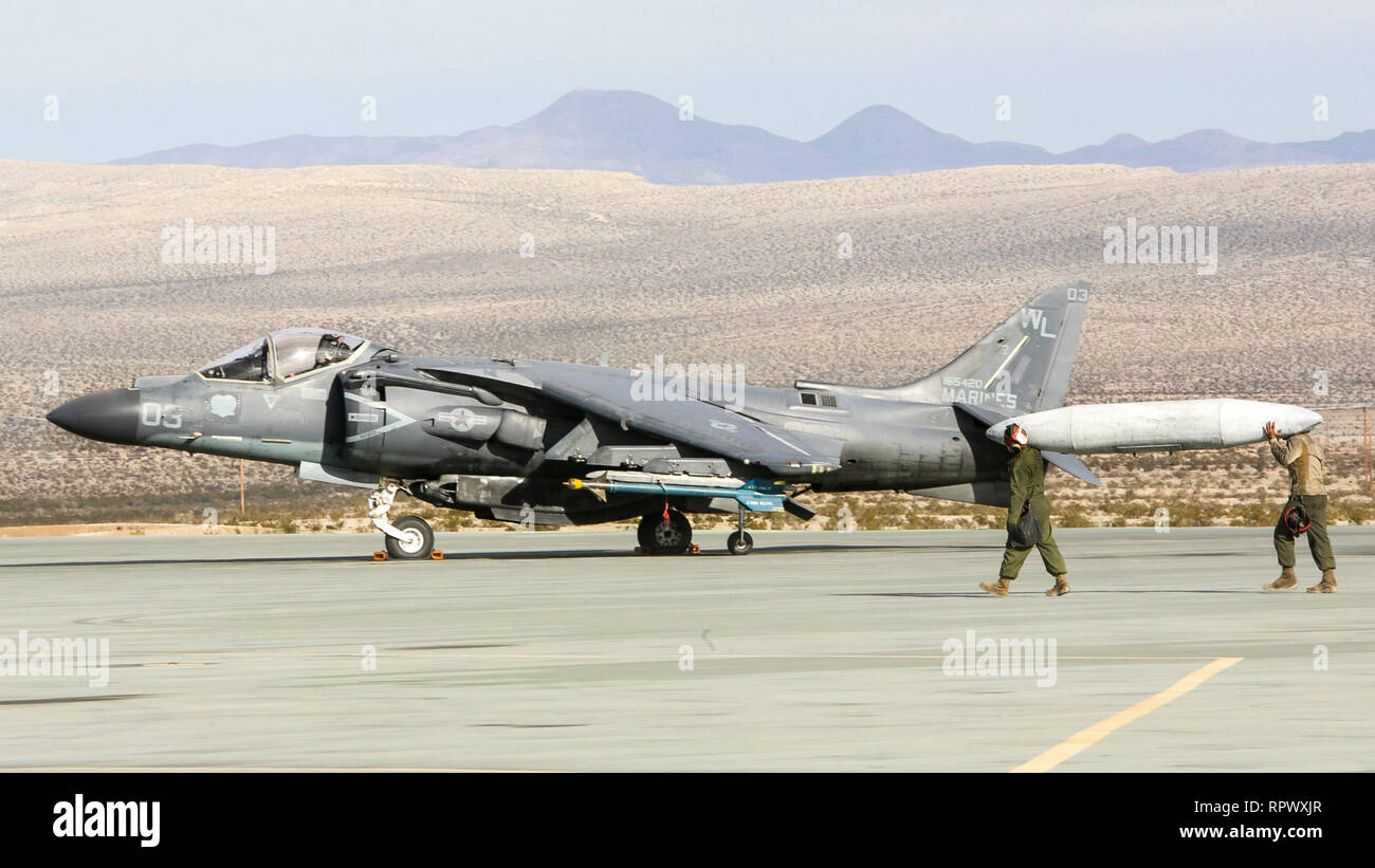 U.S. Marines with Marine Attack Squadron (VMA) 311, Marine Aircraft Group (MAG) 13, 3rd Marine Aircraft Wing (MAW), transport a fuel tank to an AV-8B Harrier at Marine Corps Air Ground Combat Center (MCAGCC) Twentynine Palms, Calif., Feb. 15. Eleven AV-8B Harriers with VMA-311 launched from MCAGCC Twentynine Palms in an epic display of combat power. Over the course of several hours, more than 100 aircraft from MAG-13 and MAG-39 took to the skies over Southern California, proving 3rd MAW's capability to 'Fix, Fly, Fight' and, when needed, advance at a moment's notice.  (U.S. Marine Corps photo  Stock Photo