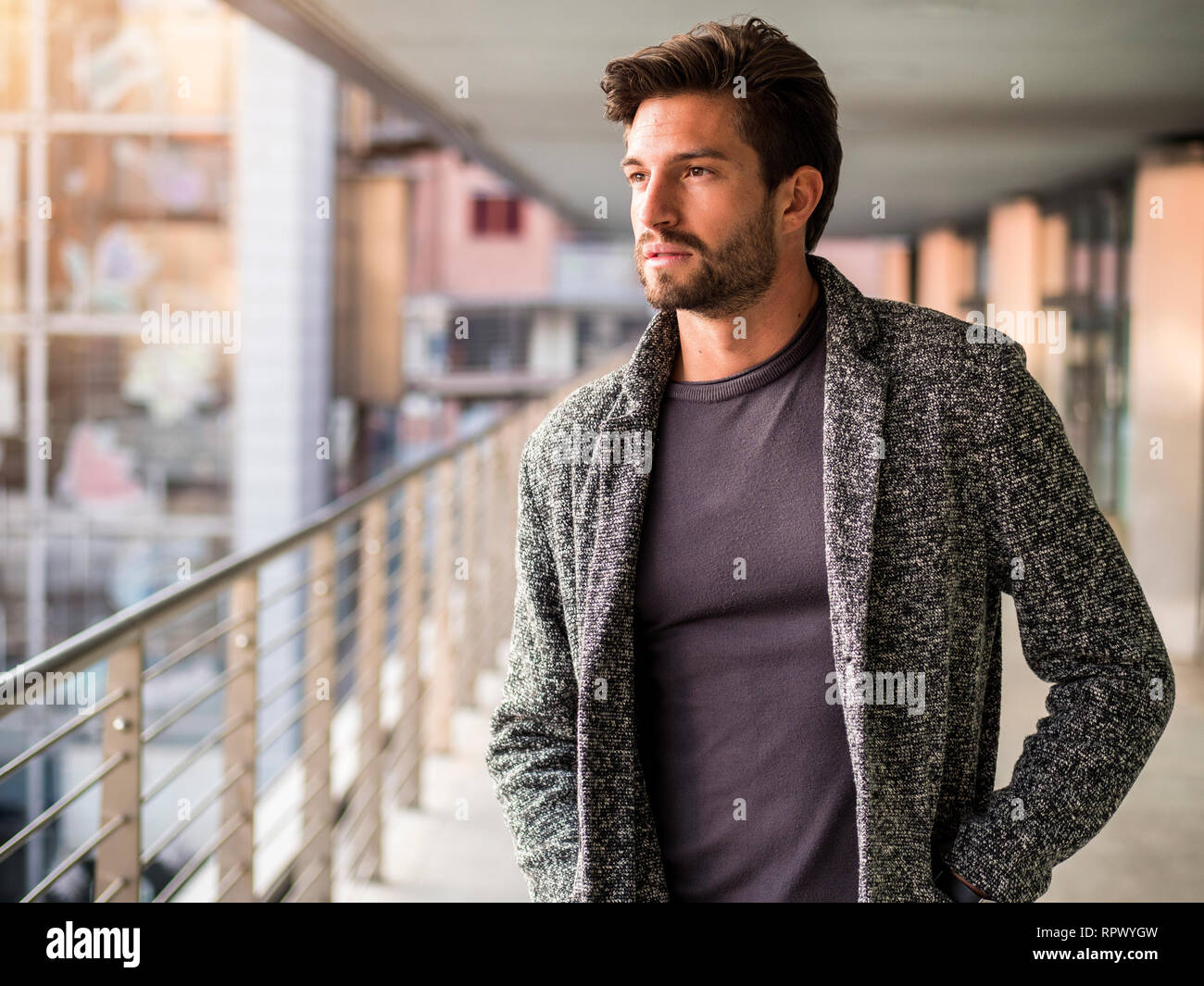 One handsome young man in city setting Stock Photo - Alamy