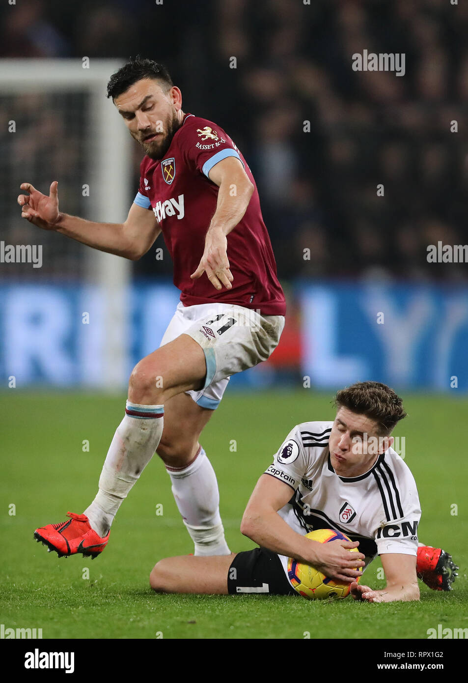 Tom Cairney of Fulham is fouled by Robert Snodgrass of West Ham United - West Ham United v Fulham, Premier League, London Stadium, London (Stratford)  Stock Photo