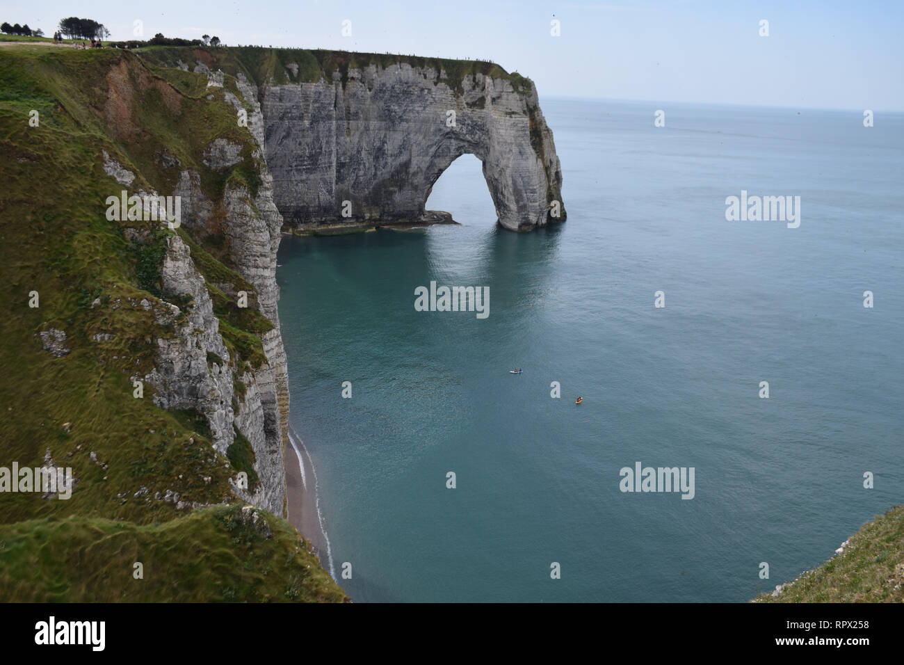Landscape with scenic alabaster chalk cliffs of Etretat and coast of