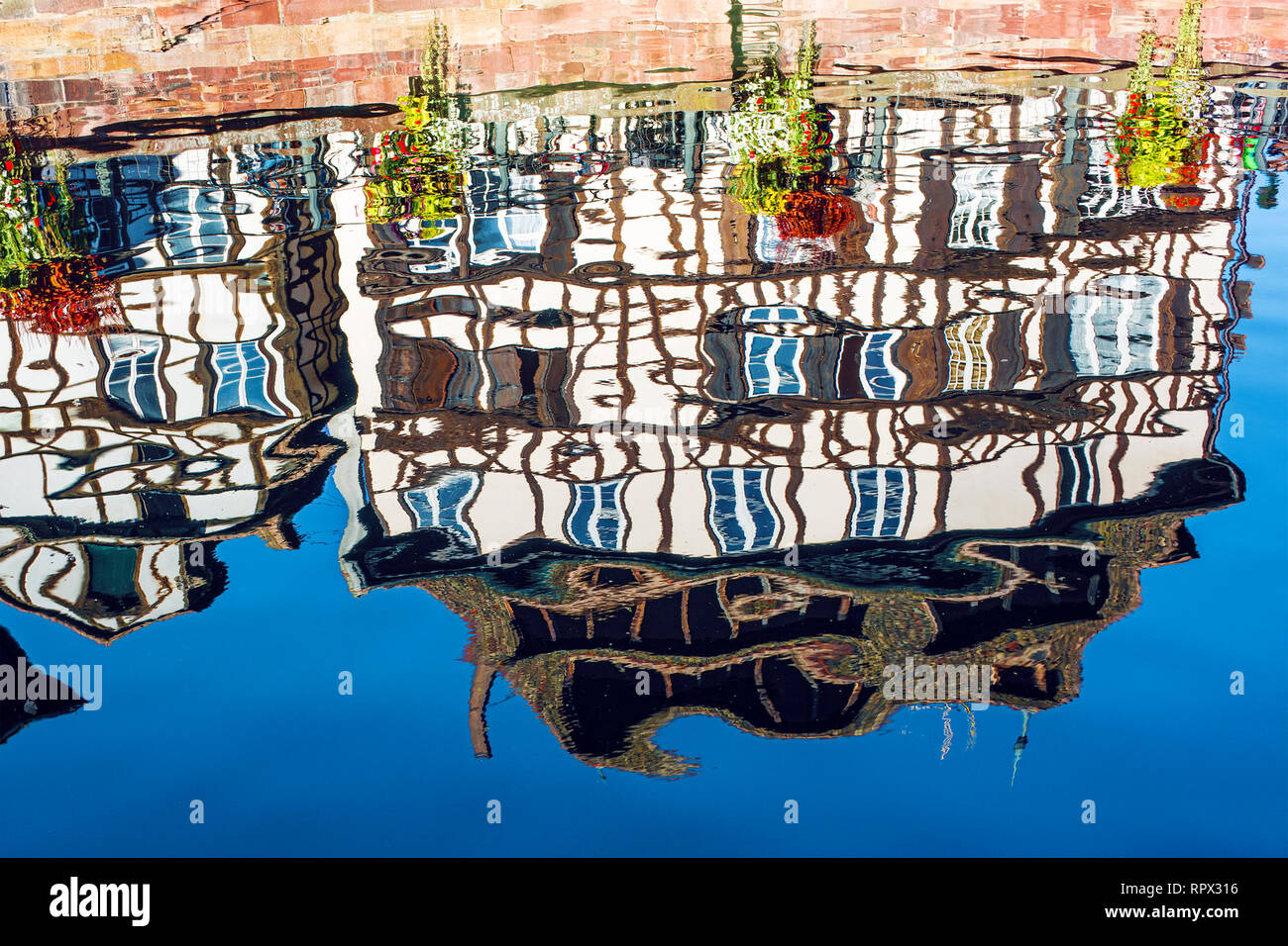 Reflections of traditional timber-frame houses in water, Strasbourg, France Stock Photo