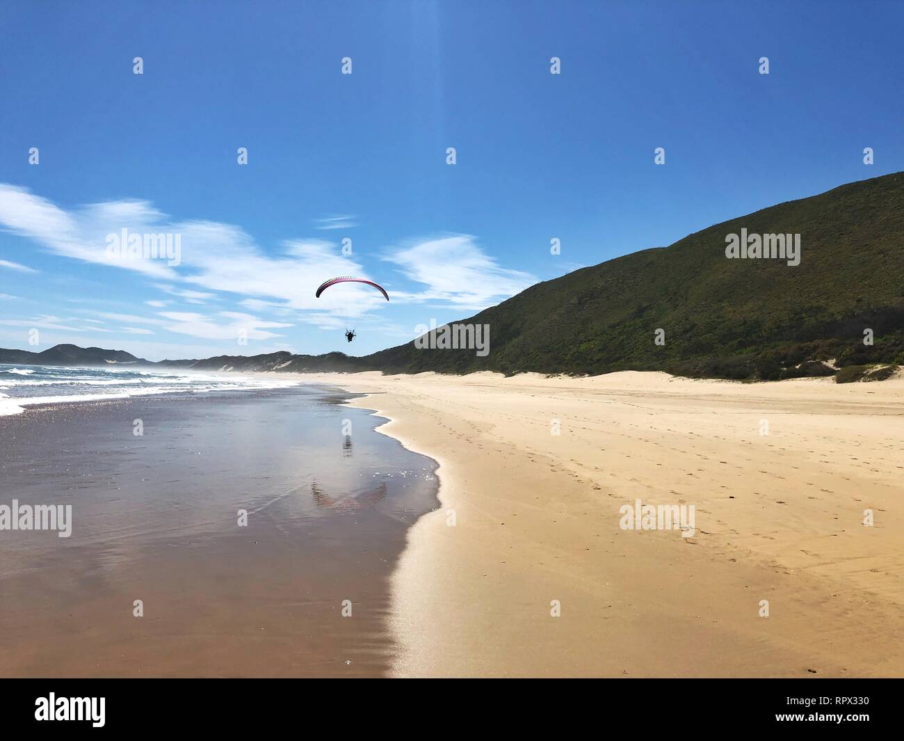 Paraglider on beach, Brenton on Sea, Western Cape, South Africa Stock Photo