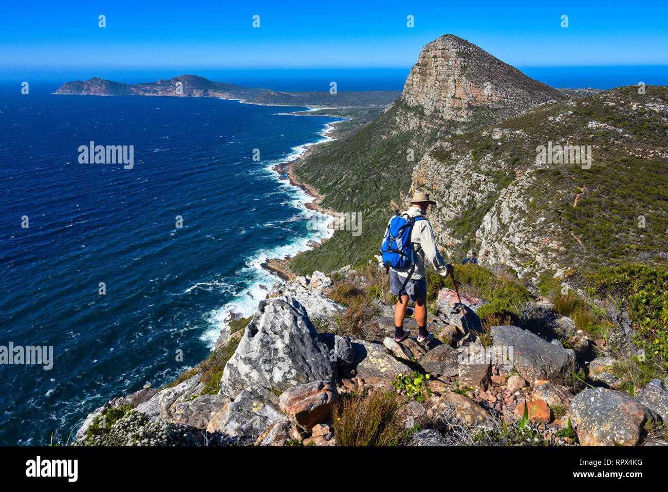 Two men hiking on Cape of Good Hope Hiking Trail, Western Cape, South Africa Stock Photo