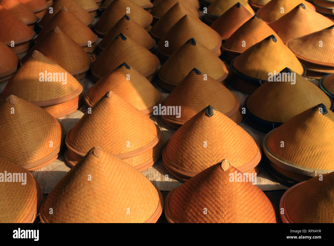 Close-up of bamboo hats in a row, Indonesia Stock Photo