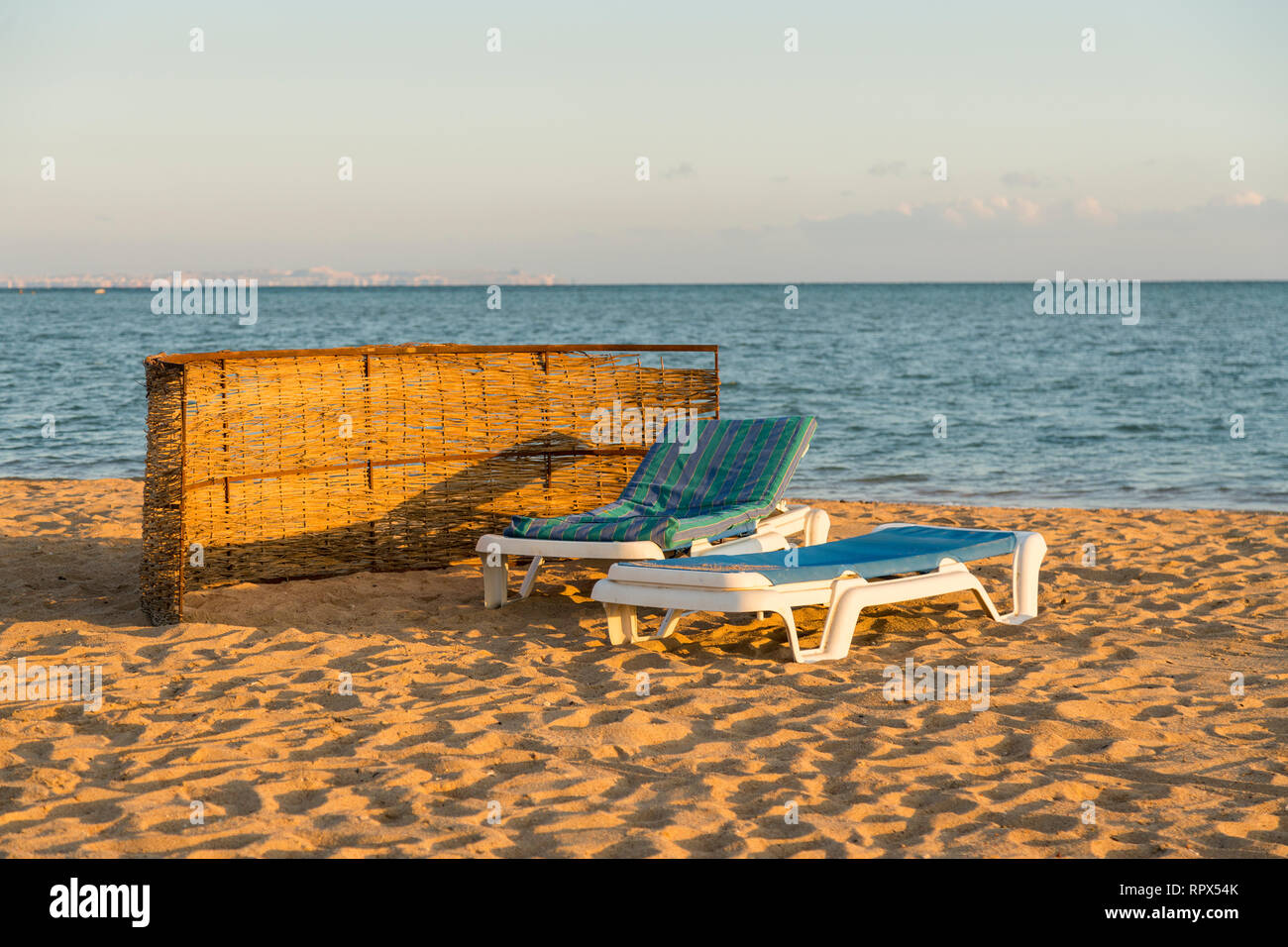 Sun beds on the beach. Beach holiday concept Stock Photo Alamy