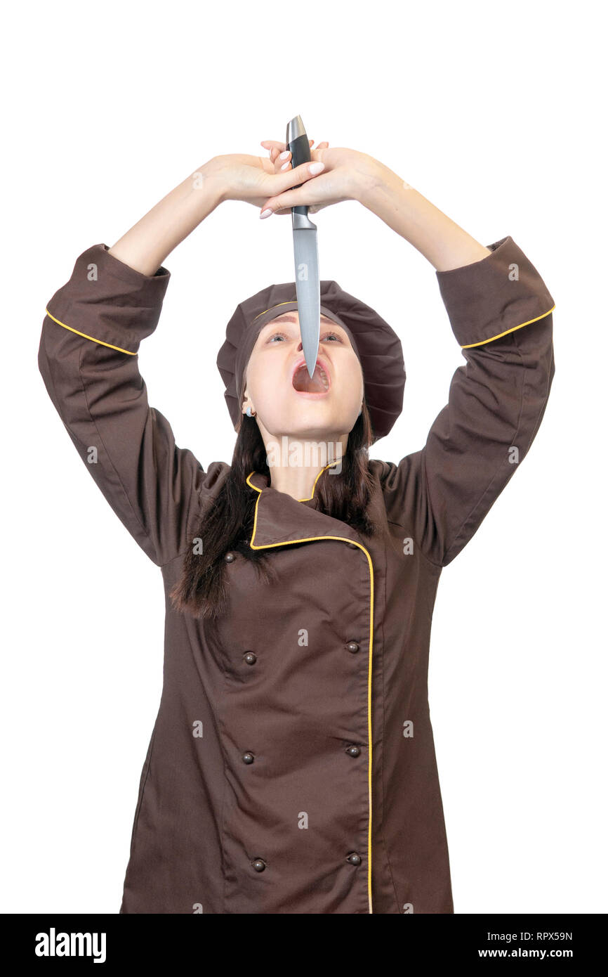 woman cook trying to swallow a knife by putting it in her mouth isolated on white background