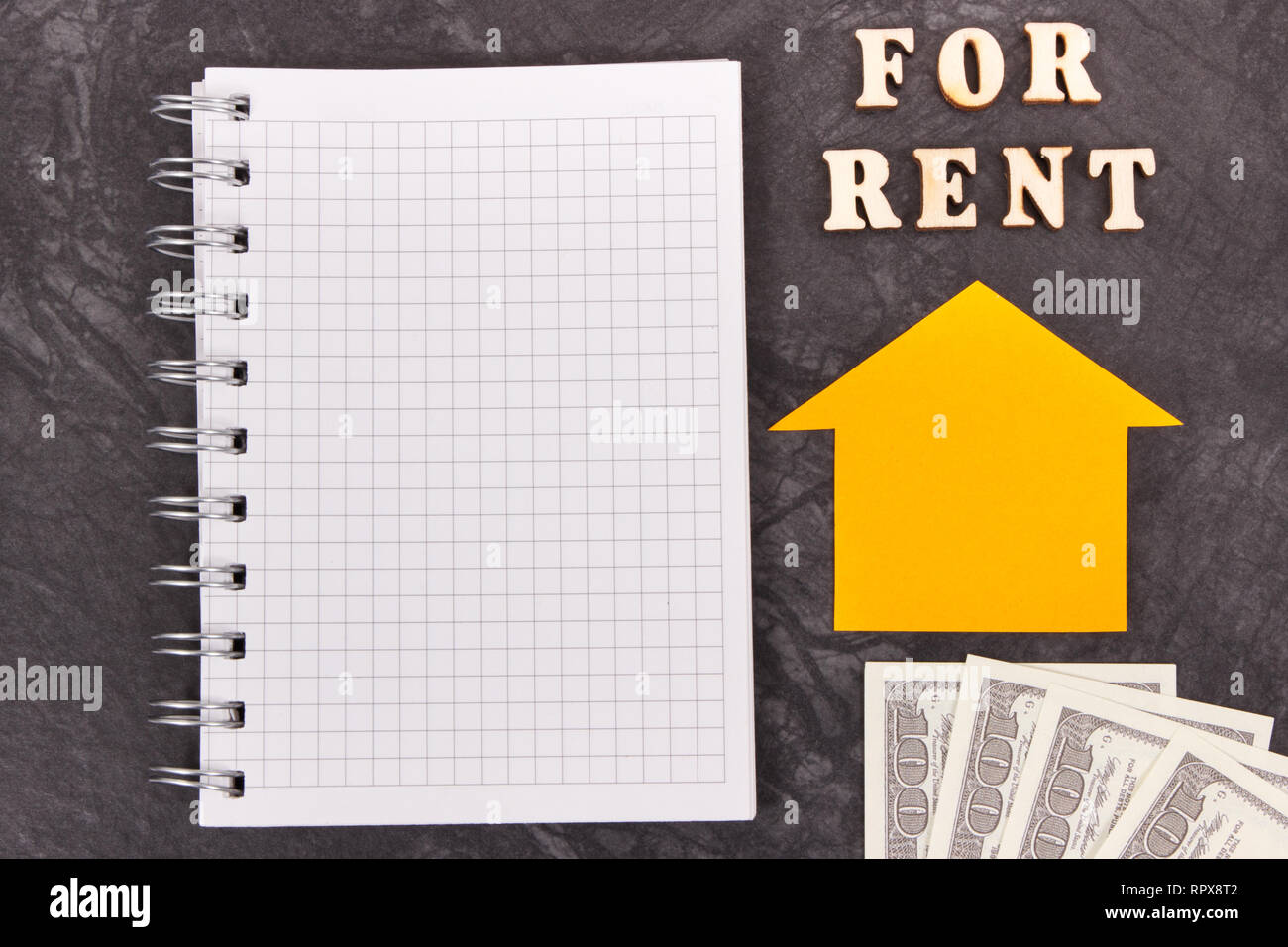 Inscription for rent, currencies dollar and notepad for writing notes ...