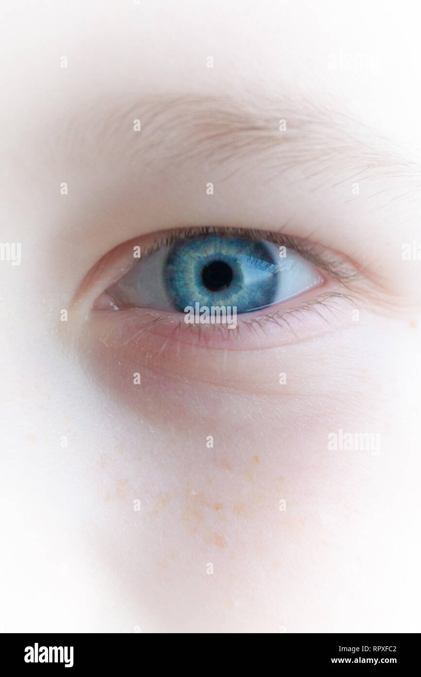 Baby blue beautiful, brooding eyes of a boy Stock Photo - Alamy