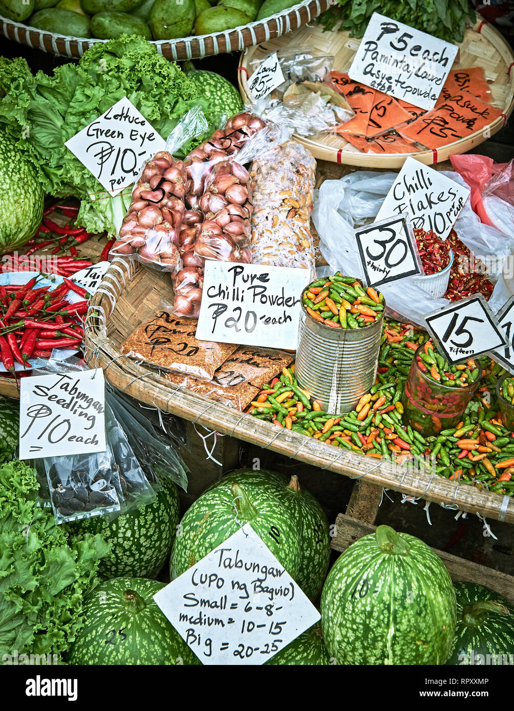 Mixed vegetables, fruits and spices nicely presented with price signage at the Central Market in Baguio City, Benguet Province, Philippines Stock Photo