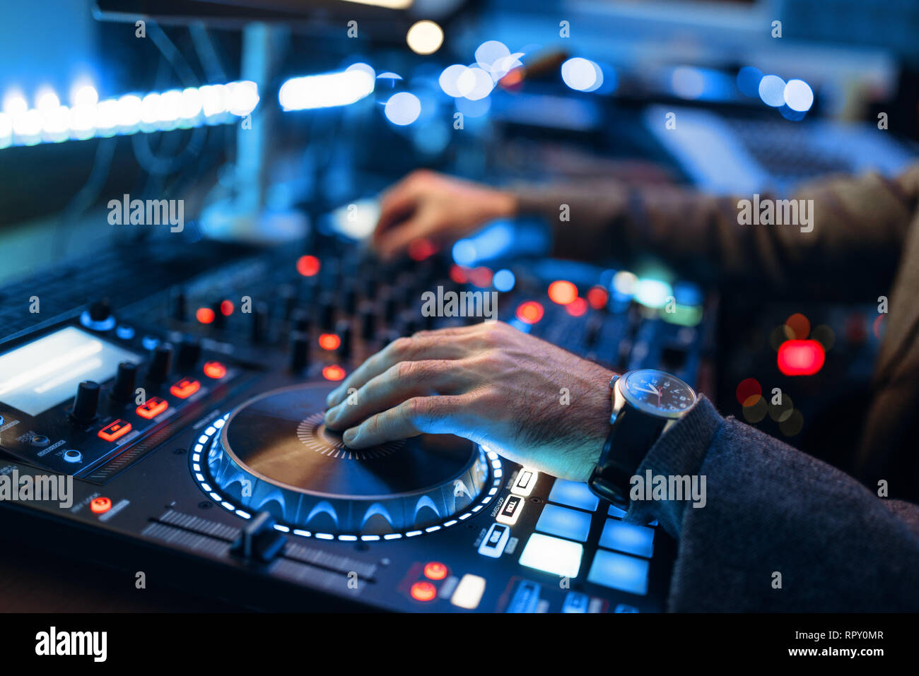 Sound operator hands over the remote control panel in the recording