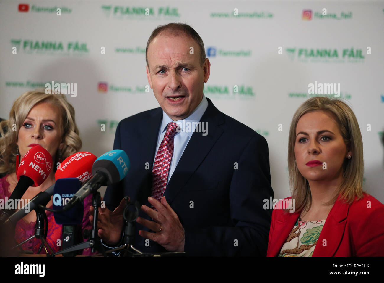 Fianna Fail leader Micheal Martin (centre) speaks to the press during his party's annual conference at the Citywest Hotel in Dublin. Stock Photo