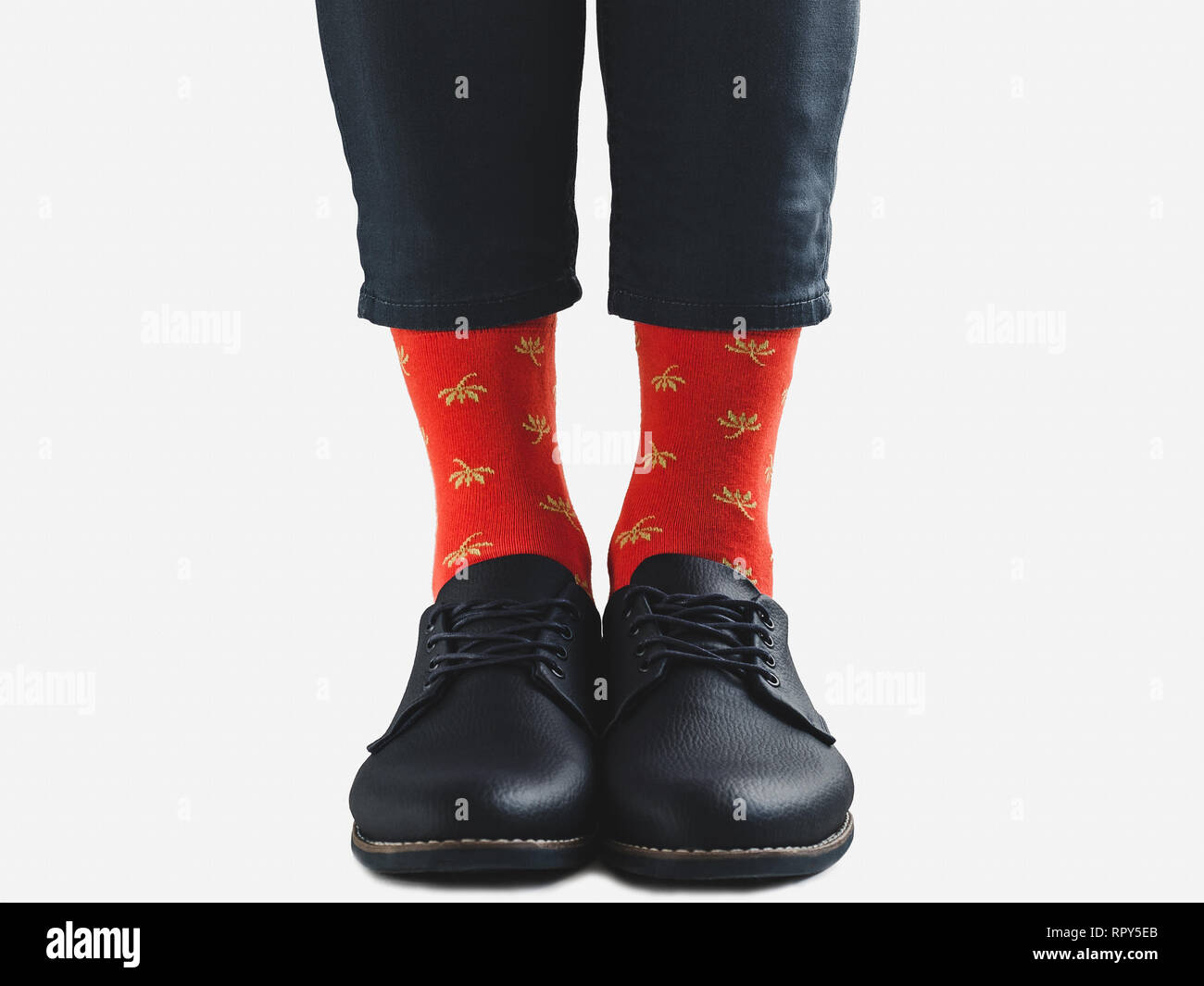 Office Manager in stylish shoes, blue pants and bright, colorful socks ...
