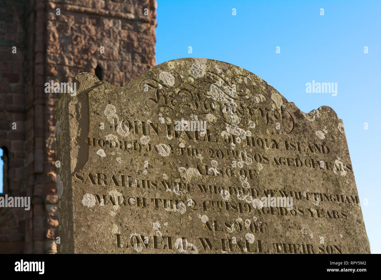 Gravestone on Lindisfarne in the ruins of the Priory, Holy Island, Northumberland, UK Stock Photo