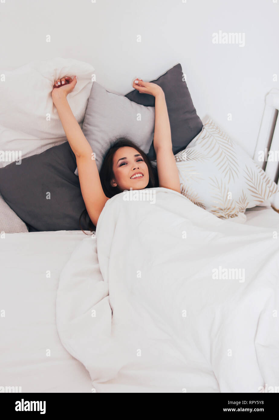 Happy Smiling Beautiful Long Hair Asian Girl Young Woman Lying Down In Bed Cozy Morning Stock Photo Alamy