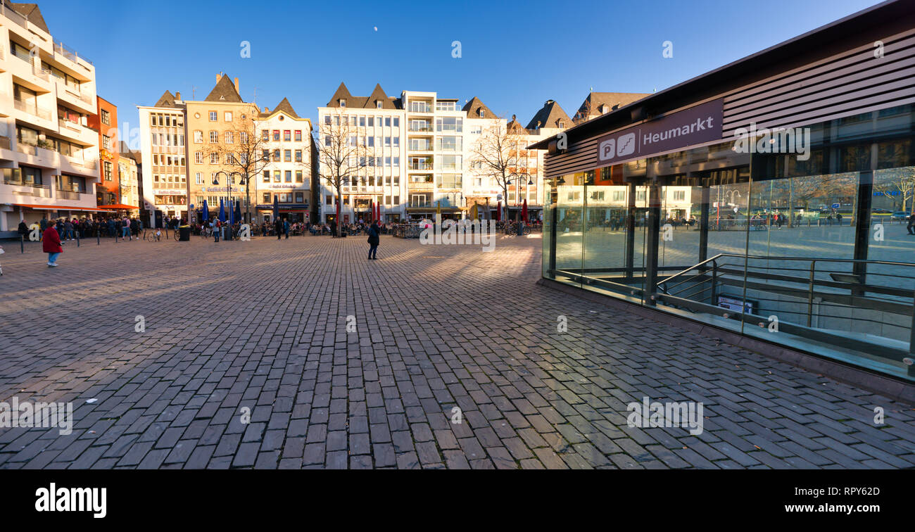 Cologne, GERMANY - February 15, 2019: Many unidentified individuals enjoy the warm sundown in the historic old town. Stock Photo