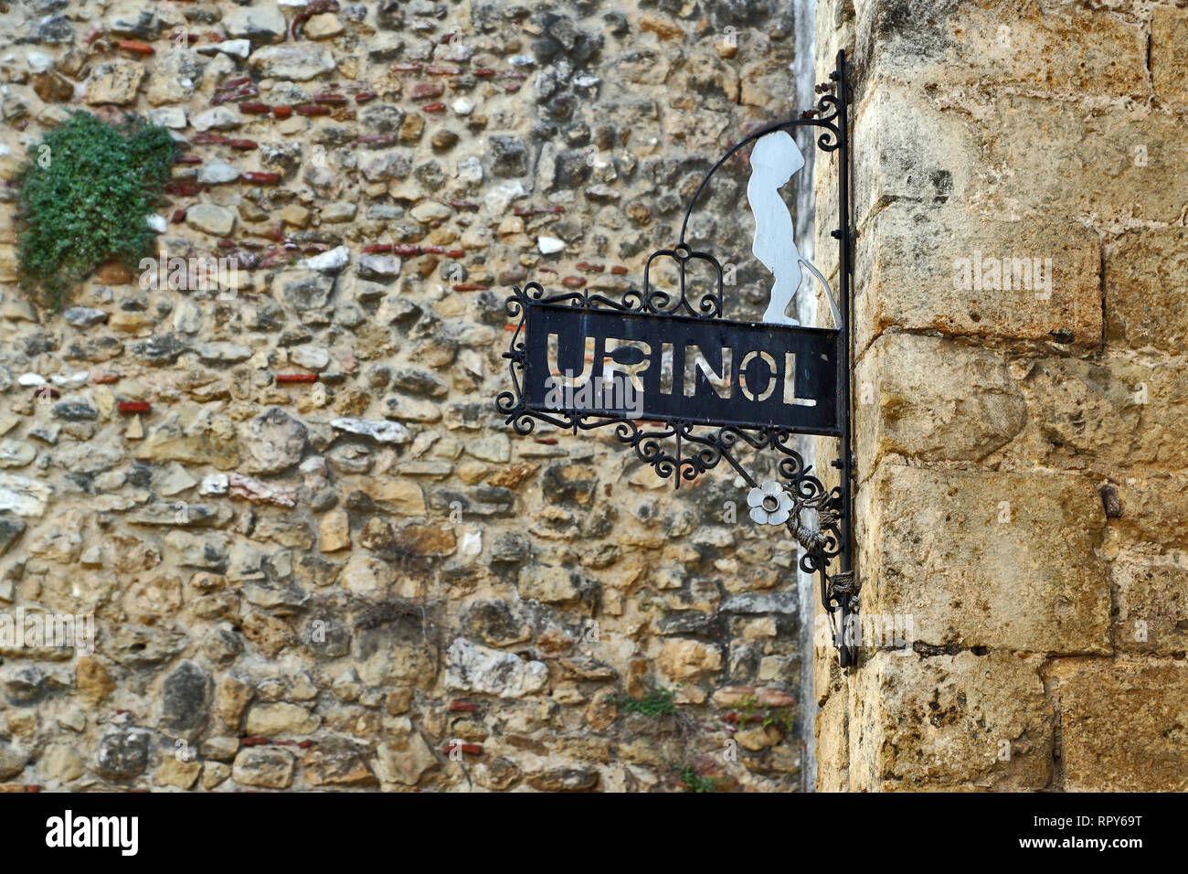 funny urinal WC sign in Lisbon Stock Photo