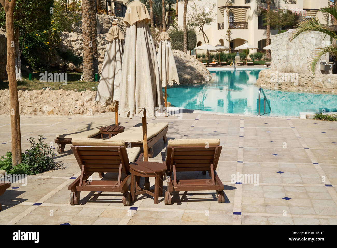 Sharm El Sheikh, Egypt - February 9, 2019: Five-star The Grand Hotel with palms and loungers near swimming pool in territory summer Stock Photo