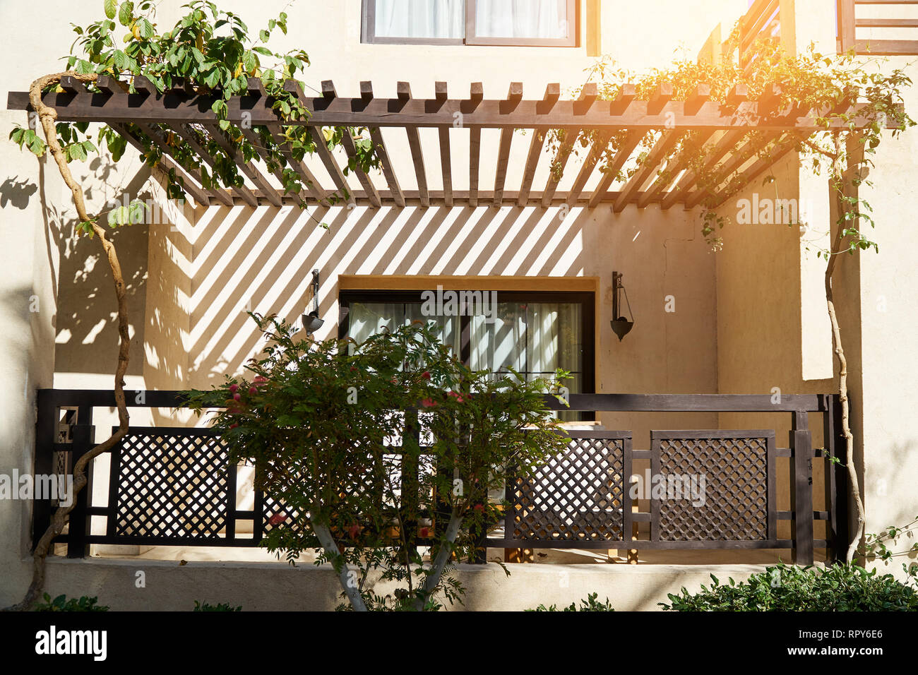 Sharm El Sheikh, Egypt - February 9, 2019: balcony facade of two-storey hotel building in the Arabic style. Tourist resort near the Red Sea. Summer Stock Photo