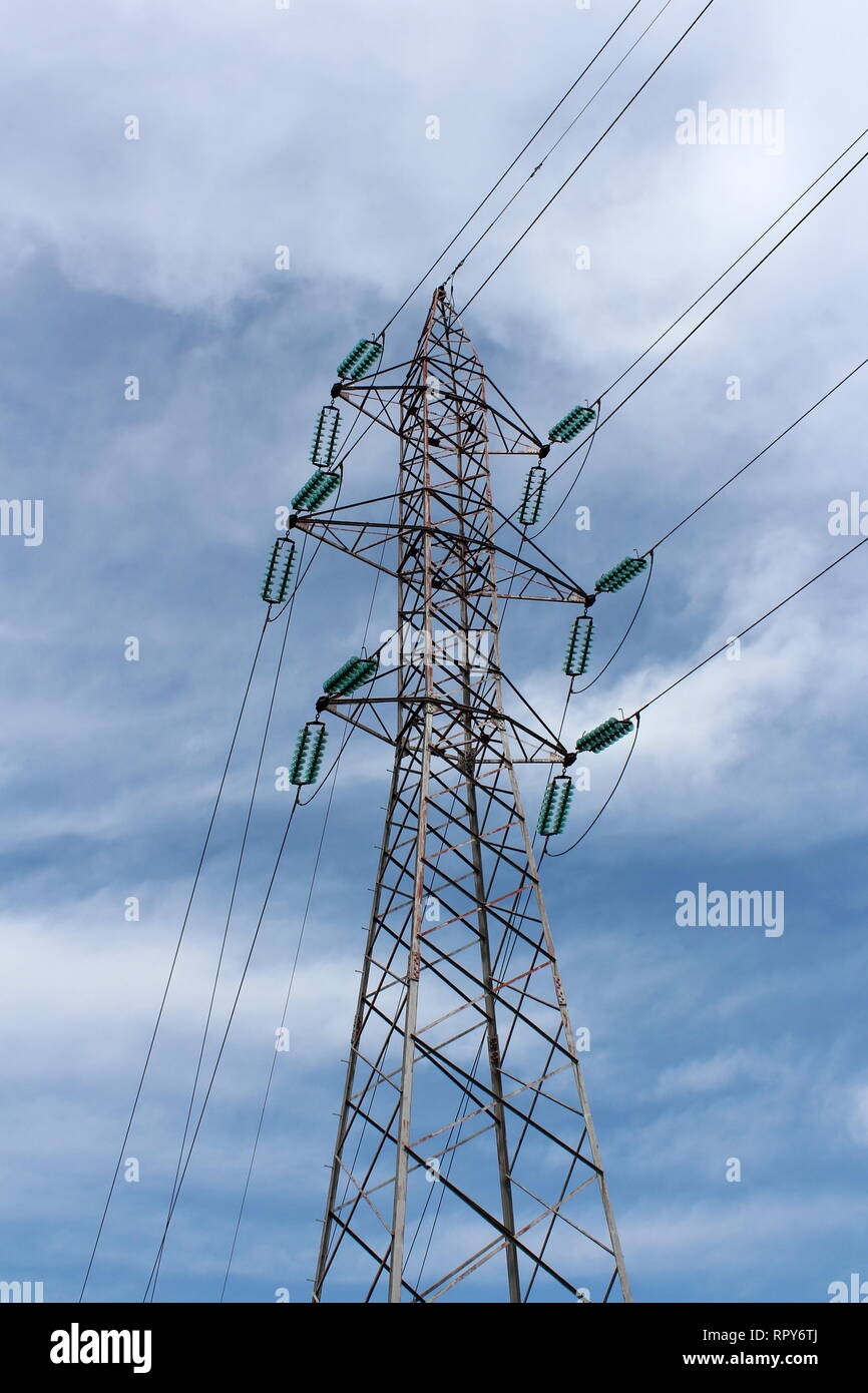 Tall power line utility pole made of metal pipes with multiple