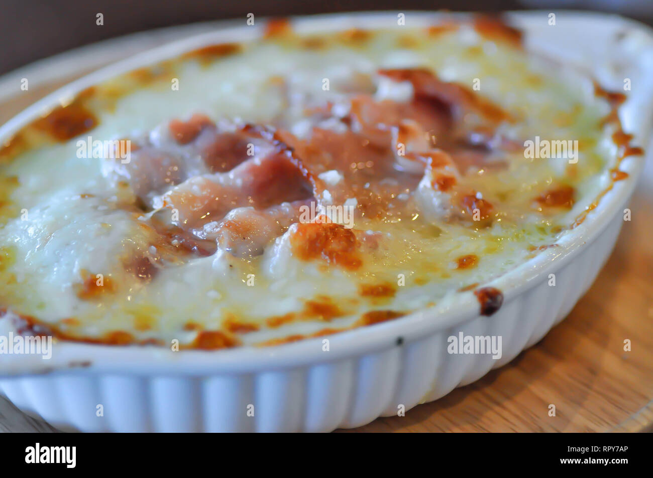 baked spinach with cheese and bacon Stock Photo - Alamy