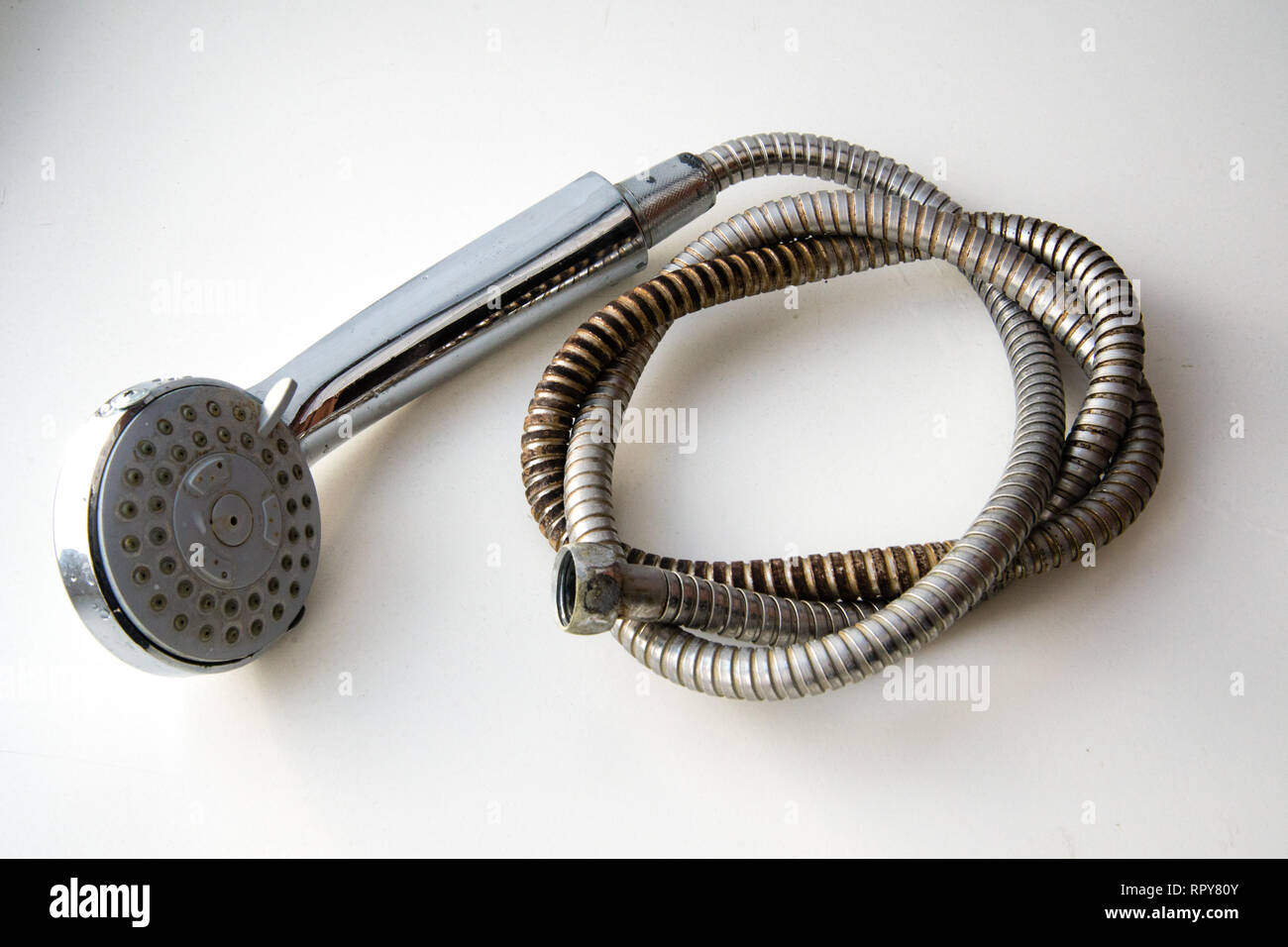 old shower hose, Old plumbing hose pipes Stock Photo Alamy