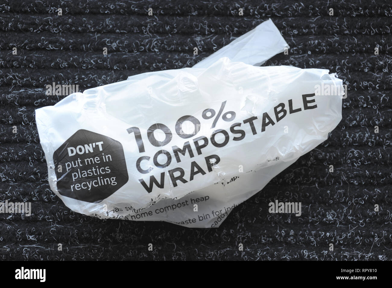 COMPOSTABLE MAGAZINE WRAPPER RE THE ENVIRONMENT RECYCLING PLASTICS WASTE CARBON EMISSIONS ETC UK Stock Photo