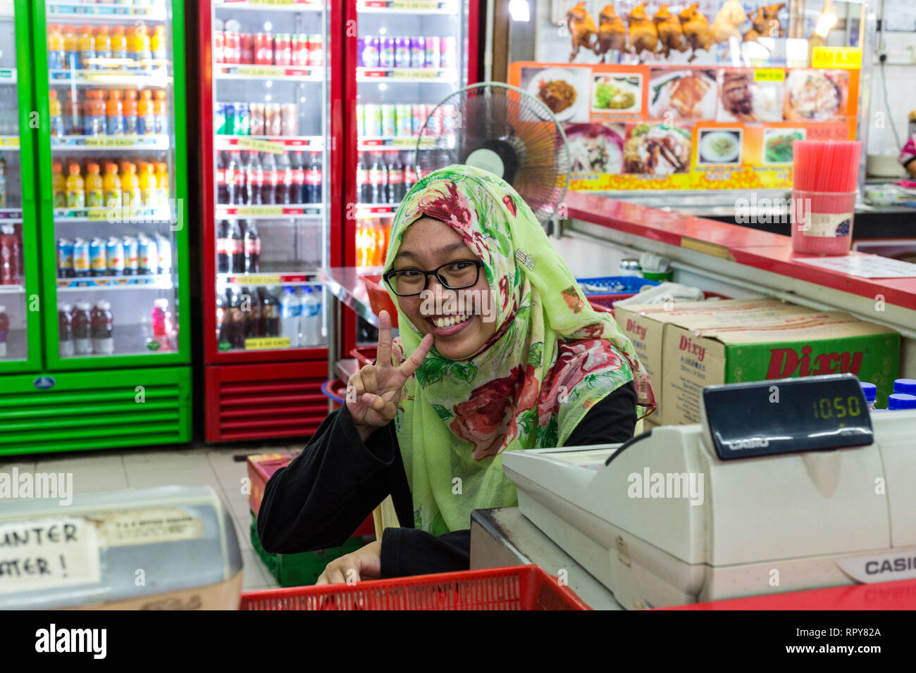 Malaysia, Roadside Rest Stop Refreshment Stand Cashier, Highway AH2. Stock Photo