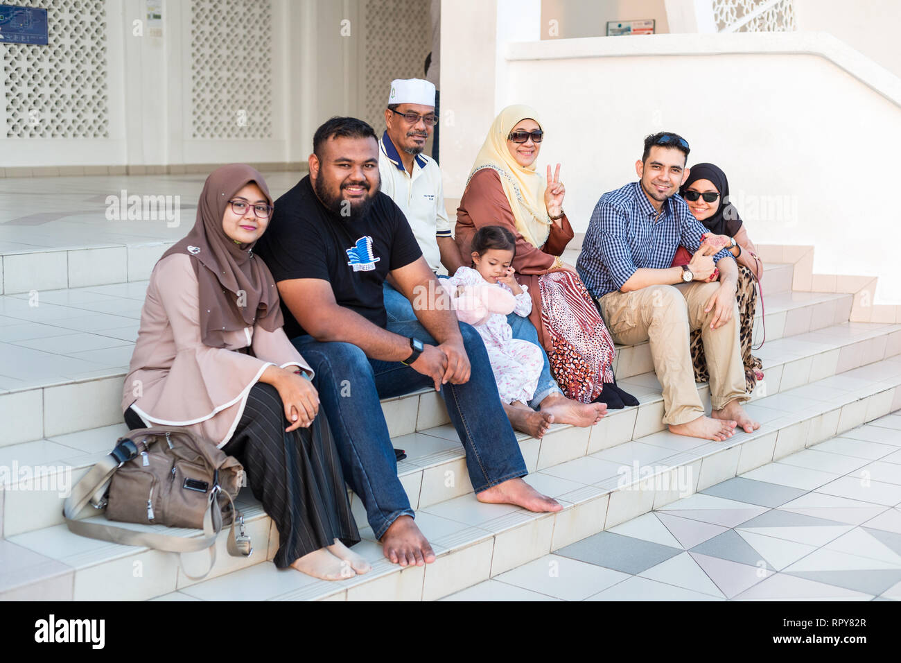 Malaysian Family Visiting the Melaka Straits Mosque, Masjid Selat, the Floating Mosque, Melaka, Malaysia. Stock Photo