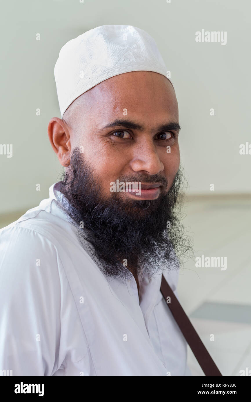 Bangladeshi Muslim Man at the Melaka Straits Mosque, Masjid Selat, the Floating Mosque, Melaka, Malaysia. Stock Photo