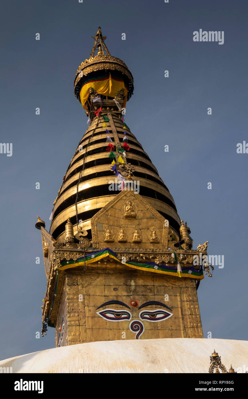Nepal, Kathmandu, Swayambhunath Temple, golden spire of Swayambhu Stupa, with Buddha’s eyes looking in all directions and Stock Photo