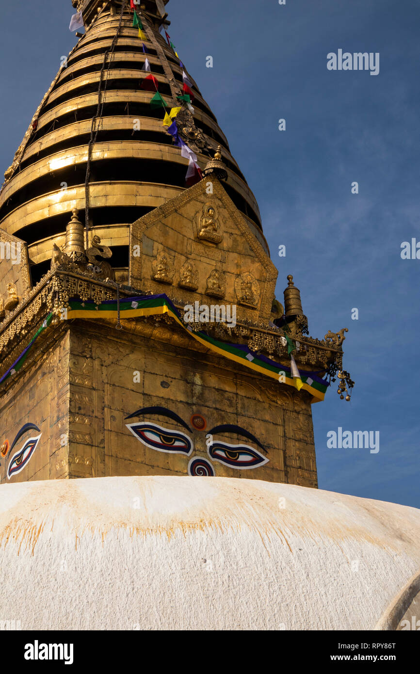 Nepal, Kathmandu, Swayambhunath Temple, golden spire of Swayambhu Stupa, with Buddha’s eyes looking in all directions Stock Photo