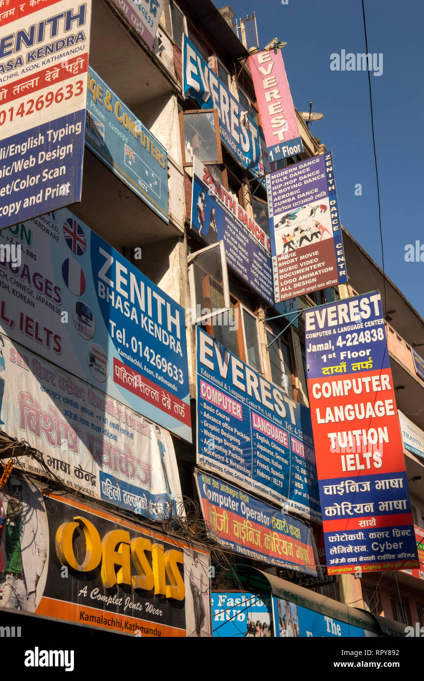 Nepal, Kathmandu, city centre, Asan Tole, Siddhidas Marga, advertising signs filling front of building Stock Photo