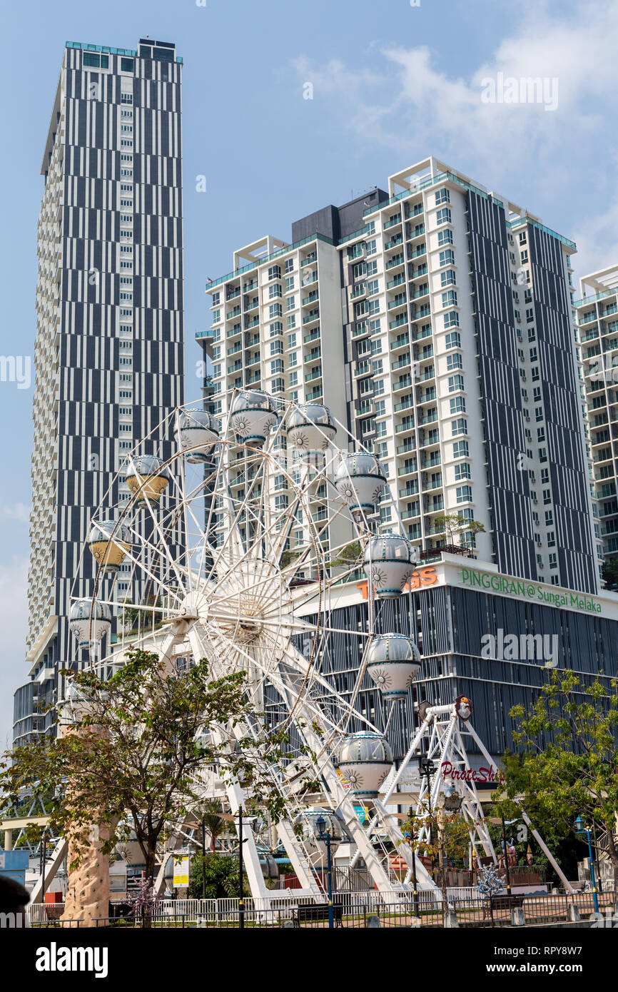 Highrise Apartment Buildings, Ferris Wheel in foreground, Melaka, Malaysia. Stock Photo