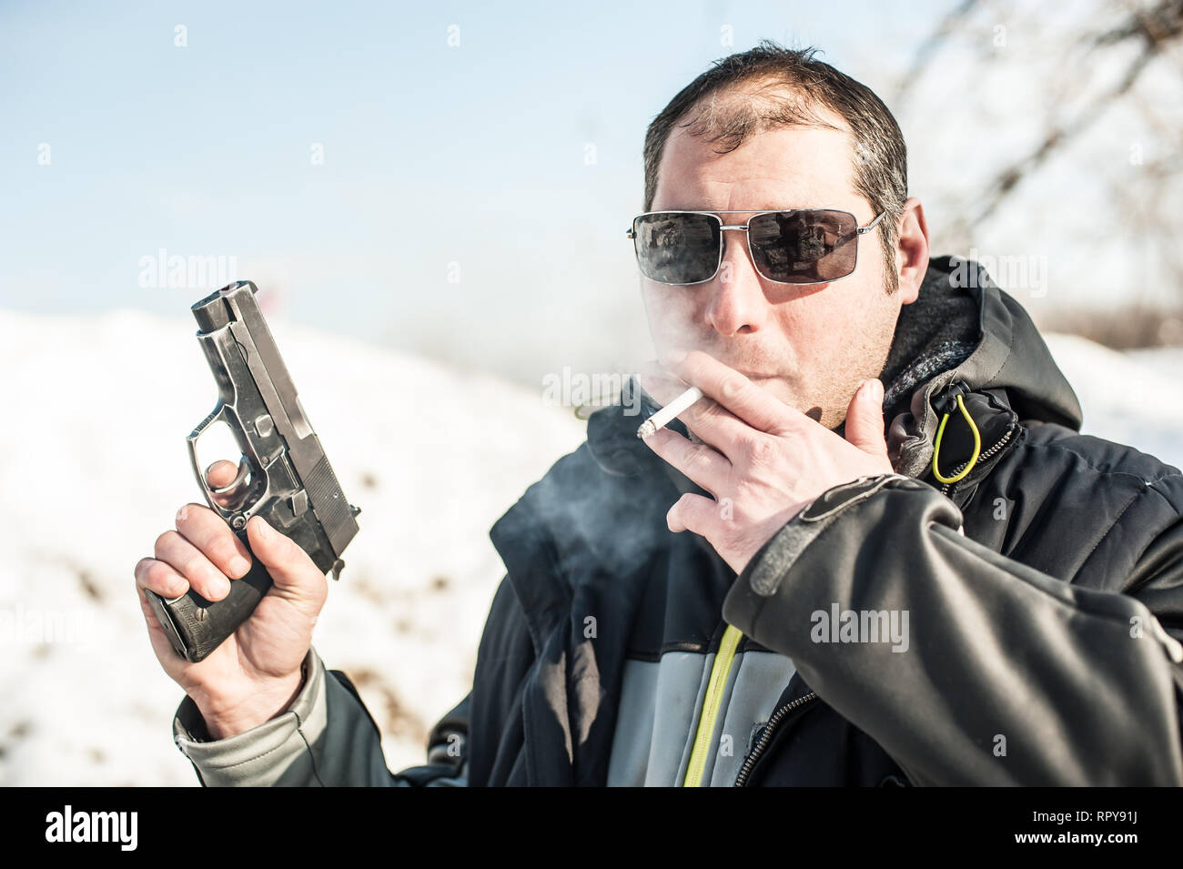 Posing with gun hires stock photography and images Alamy
