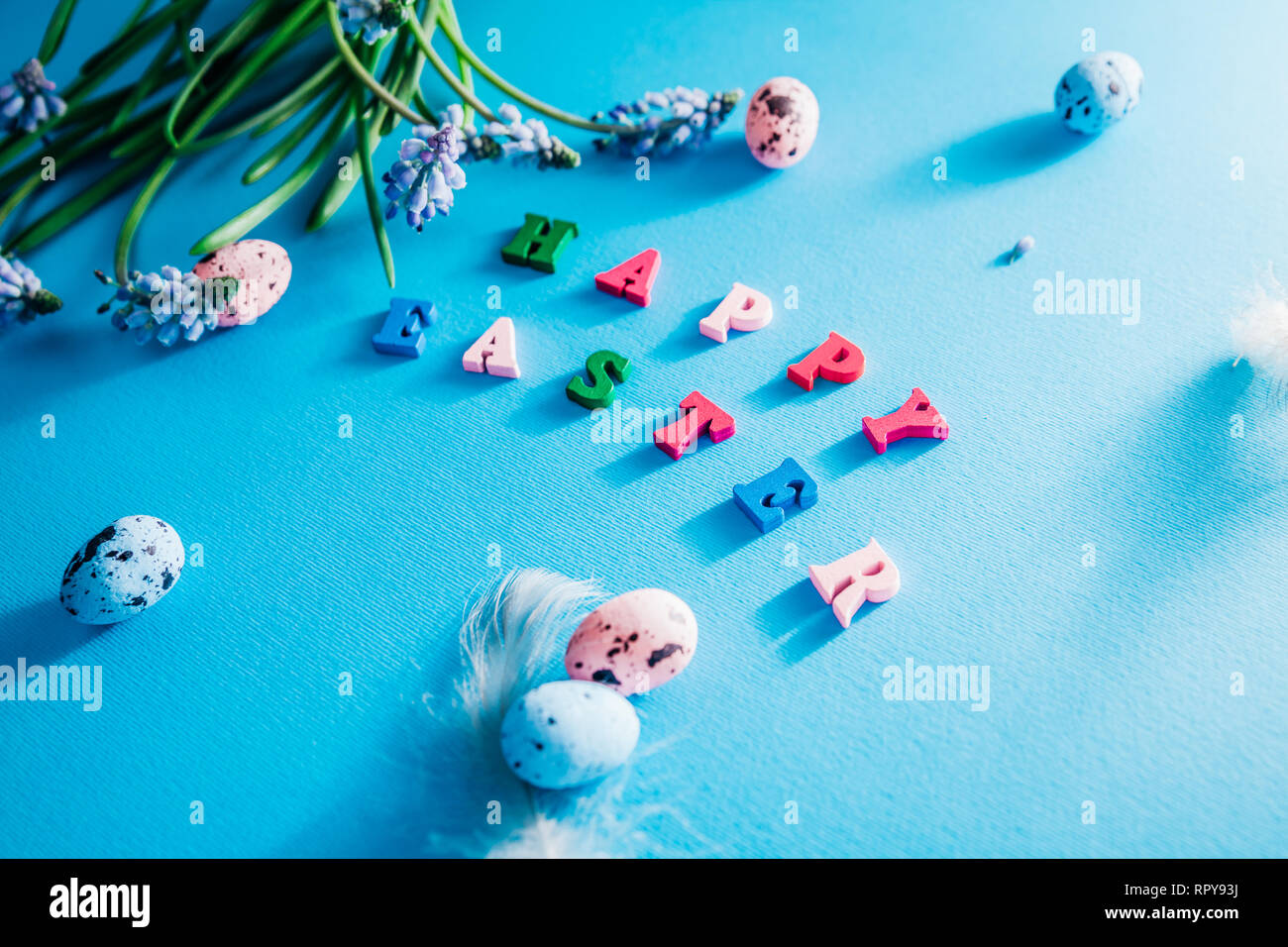Happy Easter. Easter blue background with spring flowers and eggs Stock ...